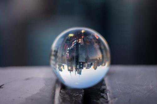 High Angle View Of Cityscape Reflecting On Crystal Ball