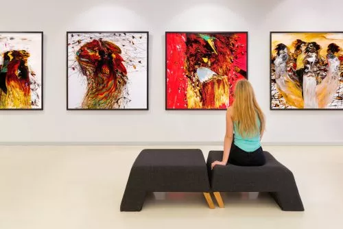 Young woman visits an art gallery