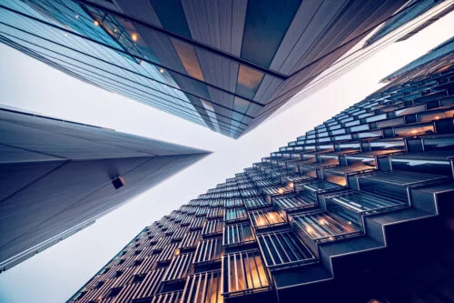 Looking directly up at the skyline of the financial district in central London - stock image