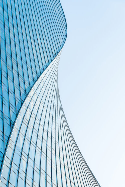 close up view of  unknown modern building exterior and glass windows.