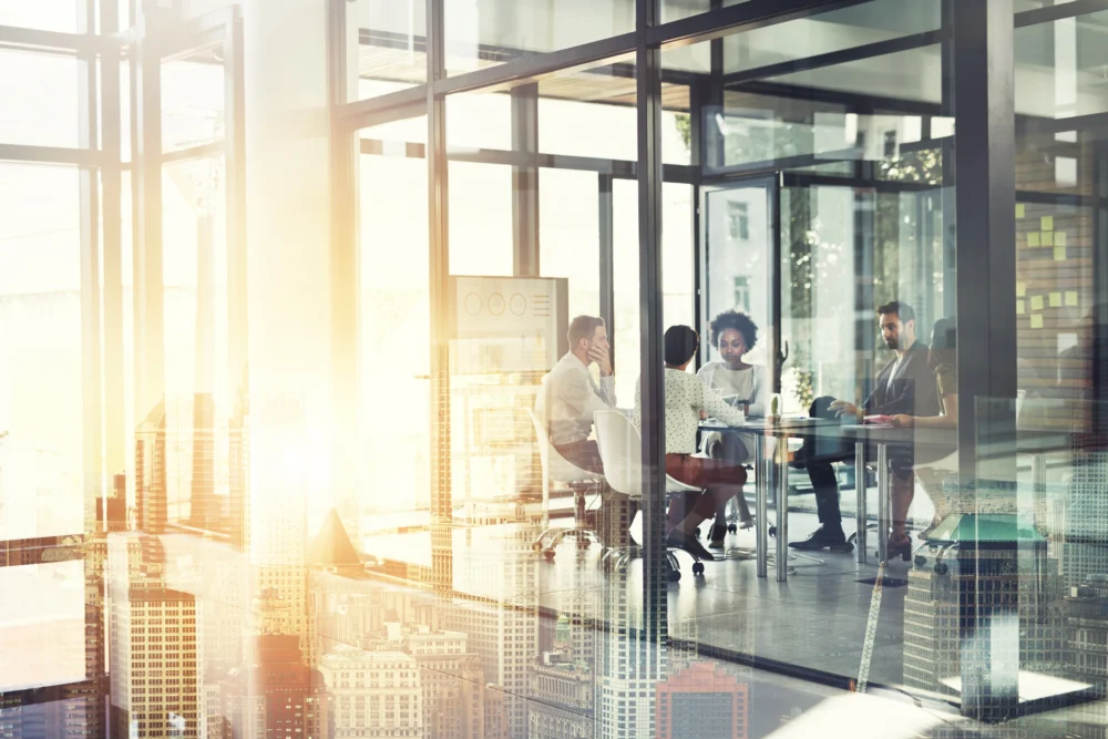 people-sitting-at-table-together-in-office-1