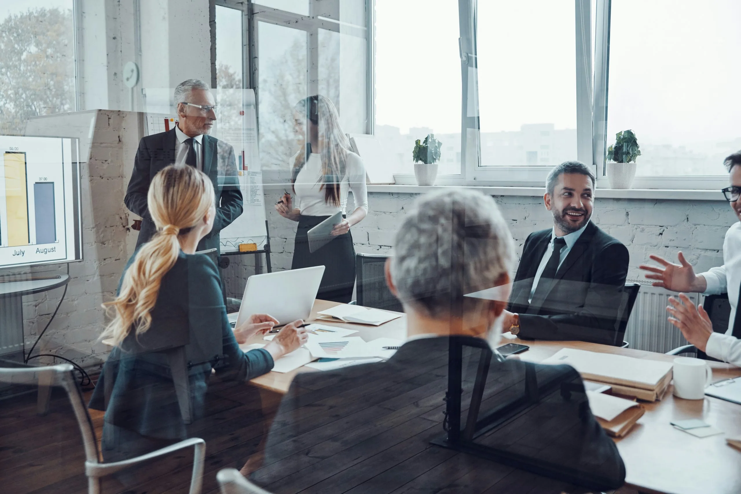 Business leaders reviewing strategy in a meeting
